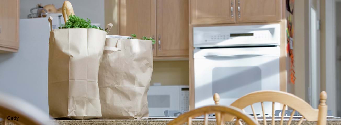 Grocery bags sitting on kitchen counter