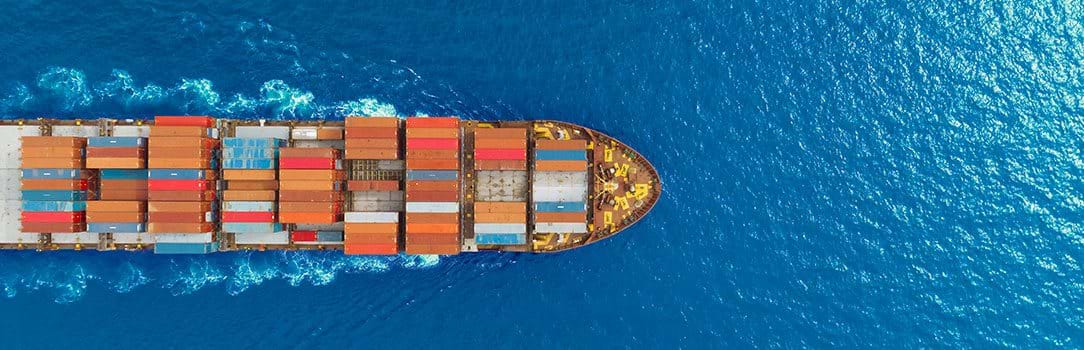 Aerial top view of a container ship at sea