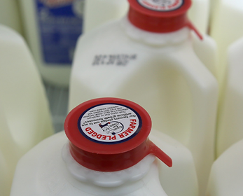 Photo of tops of milk containers