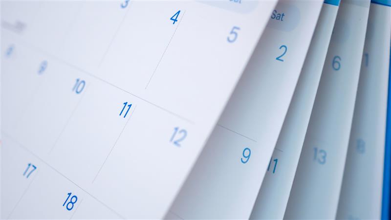 Blurred generic monthly calendar pages flipping 