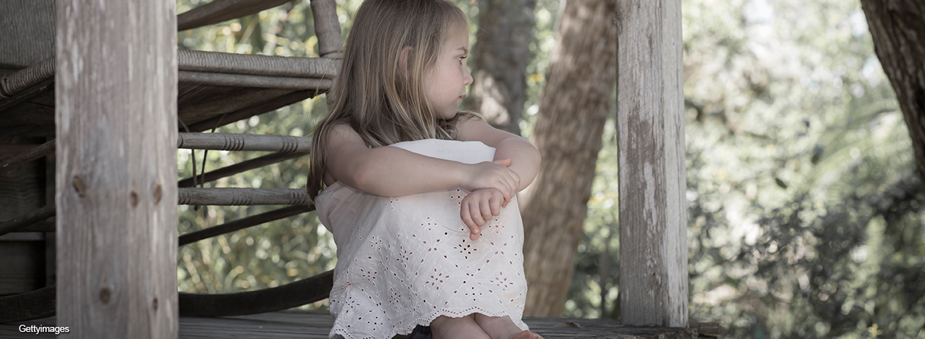 Little sitting on porch