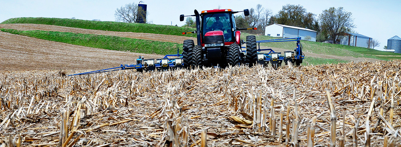 Farm equipment in corn field after the harvest