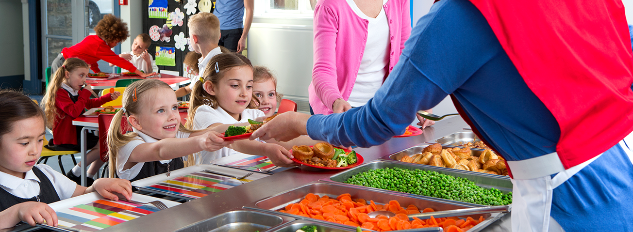 A picture of children receiving a school lunch