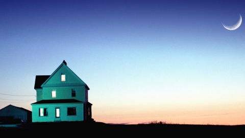 Illustration of a farmhouse with a sunset in the background.