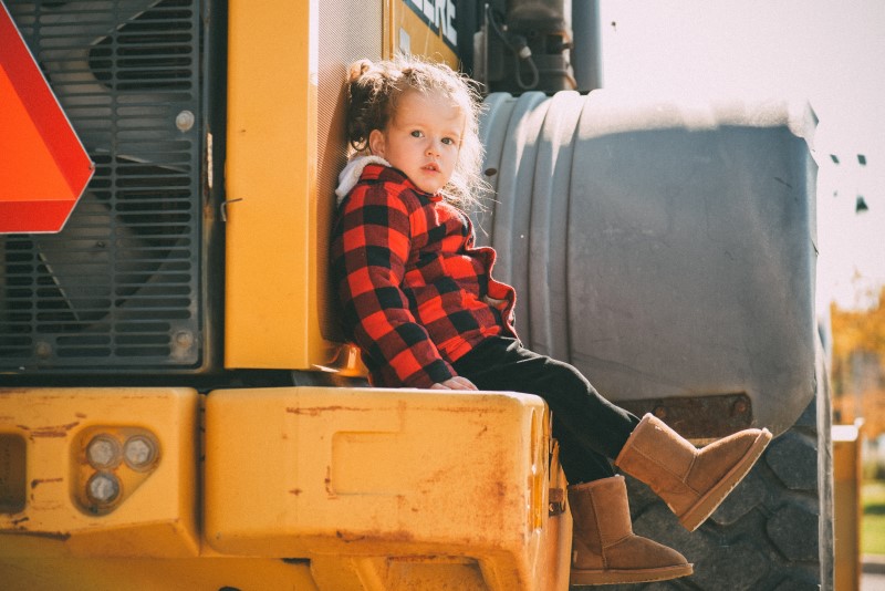 Photo of a child sitting on a tractor