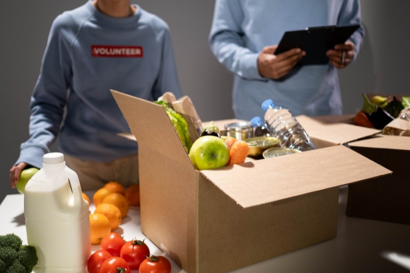 Photo of volunteers packing food boxes